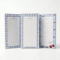 Tres notepads Cherry Picnic con diseños distintos de cerezas y moños, juntos