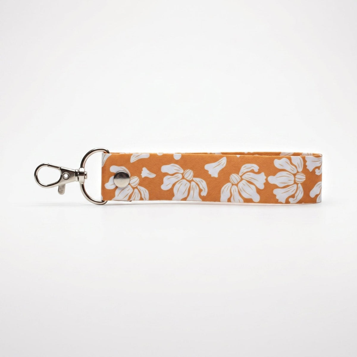 Llavero de muñeca Trino y Flora en cinta estampada de aves y flores con herraje metálico brillante, modelos A a D