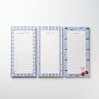 Tres notepads Cherry Picnic con diseños distintos de cerezas y moños, juntos